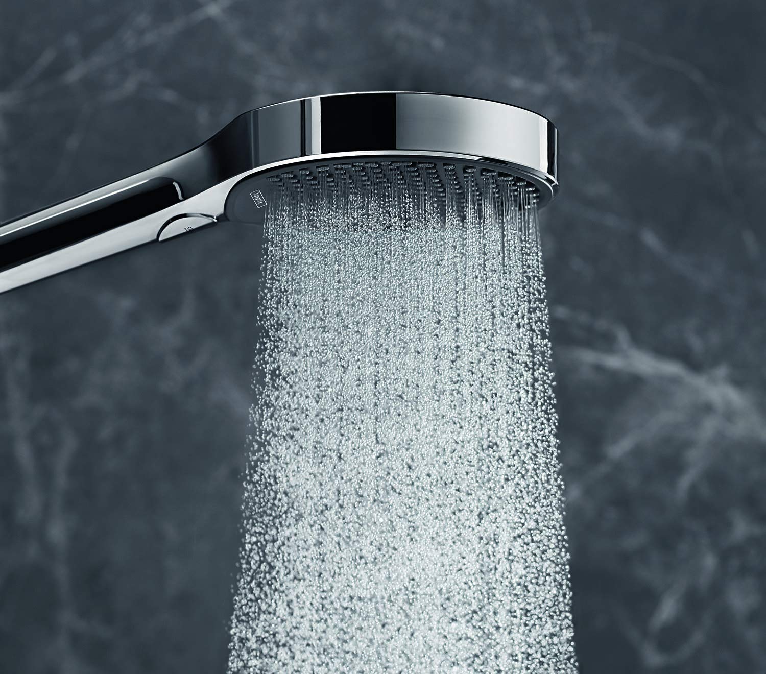 Chrome handheld showerhead with circular face dispensing water spray downward from angled arm.