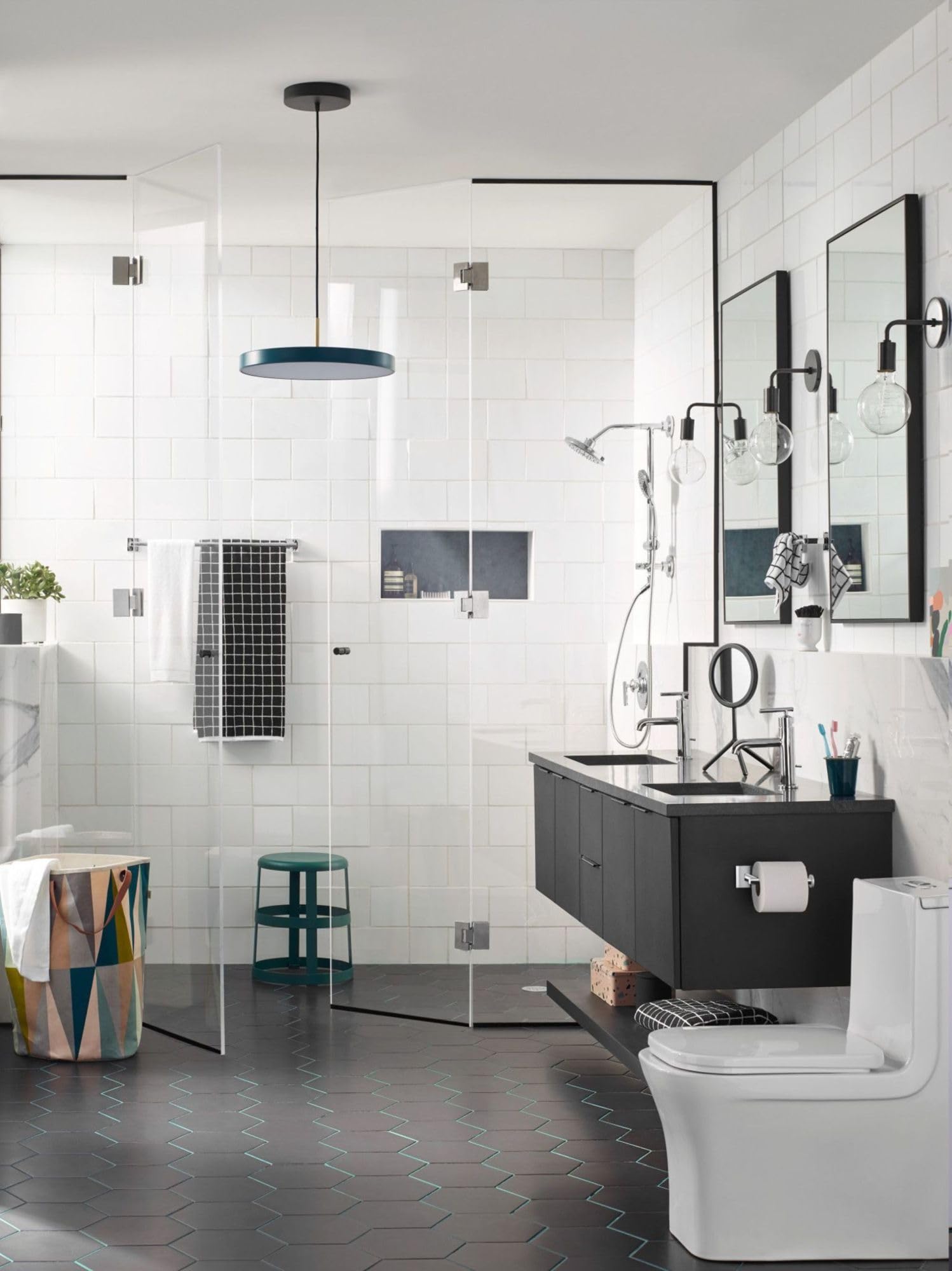Chrome towel bar mounted horizontally on white bathroom wall beside mirror.