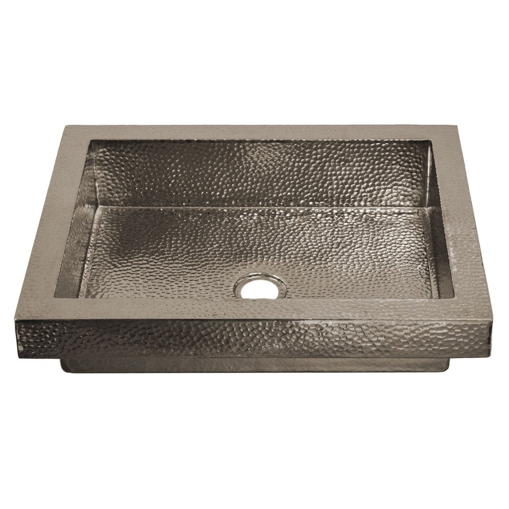 Polished nickel rectangular sink with hammered interior texture and single drain opening.