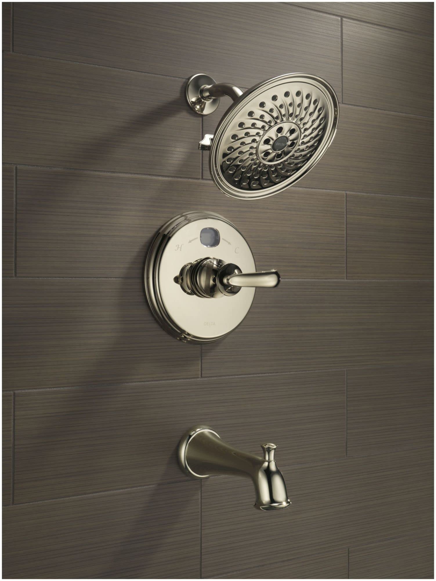 Round black stainless steel shower flange with perforated spray face mounted on tile wall with valve trim and tub spout.