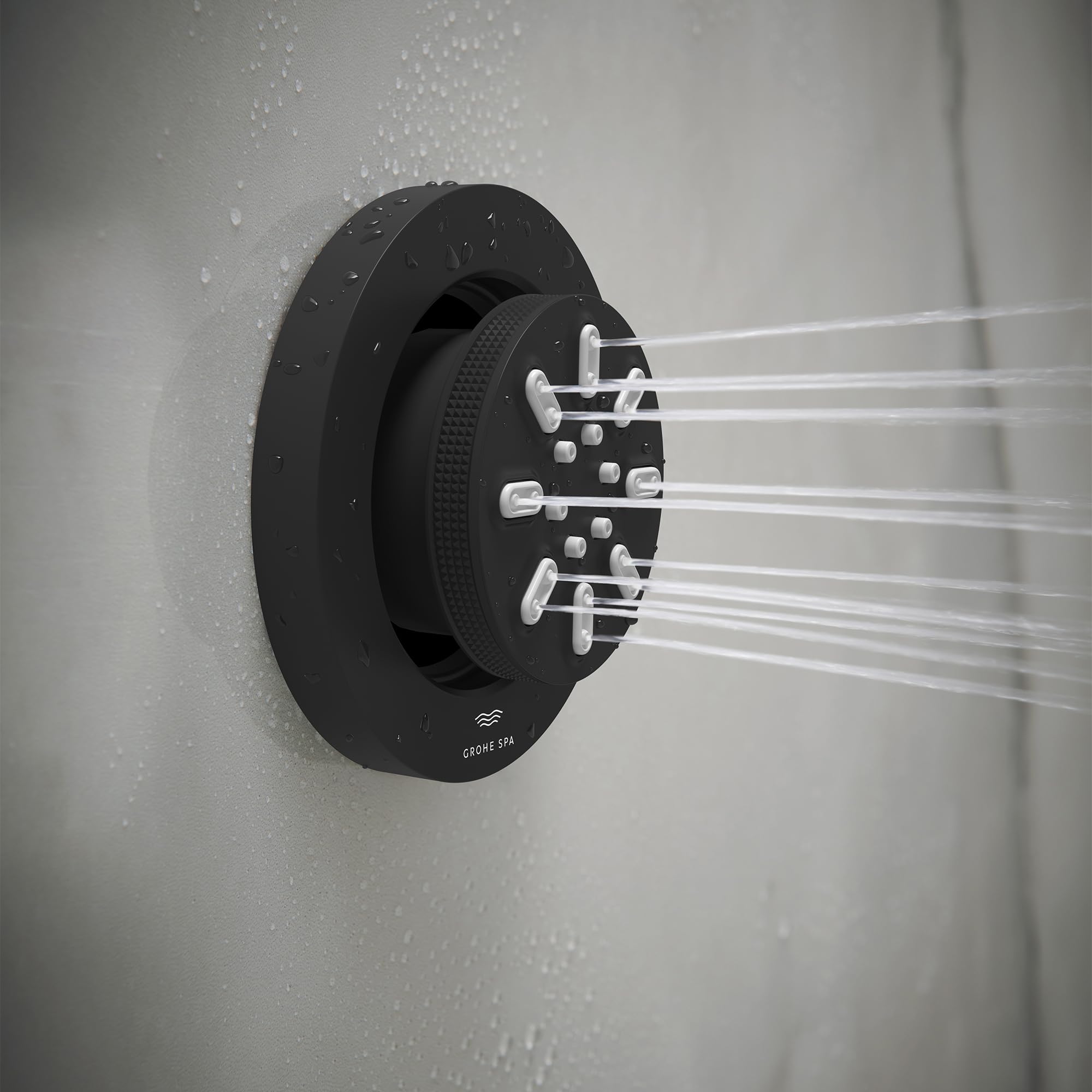 Matte black round body spray with two spray arms extending horizontally, mounted on white tile wall with water droplets.