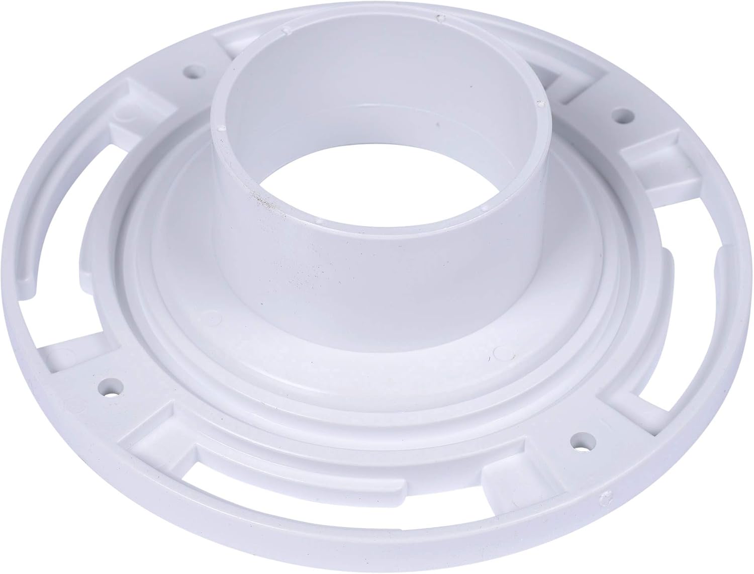 White PVC closet flange with plastic ring and mounting holes for 3-inch toilet drain connection.