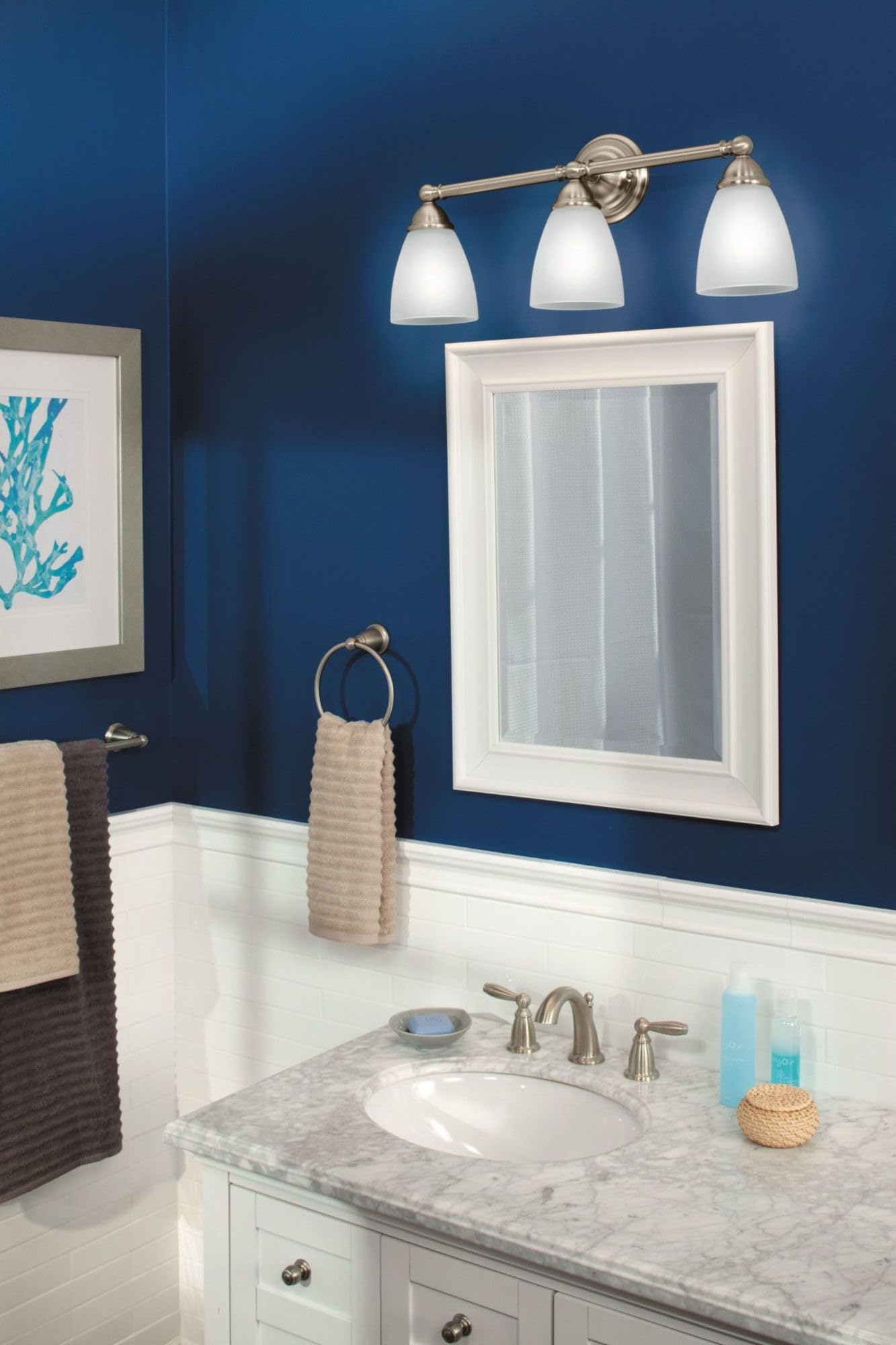 Brushed nickel wall-mount towel bar with circular mounting bracket and horizontal rod displayed in bathroom setting.