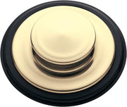 Dome-shaped sink stopper with cream-colored top and black rubber ring base, shown from above.