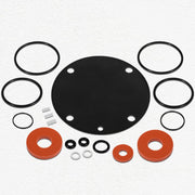 Silicone rubber kit containing black o-rings, black diaphragm, red rubber washers, metal spacers, and small metal fasteners a