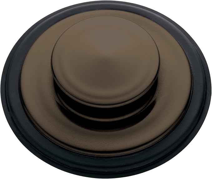 Mocha bronze sink stopper with dark rubber rim, shown from above with domed center button.