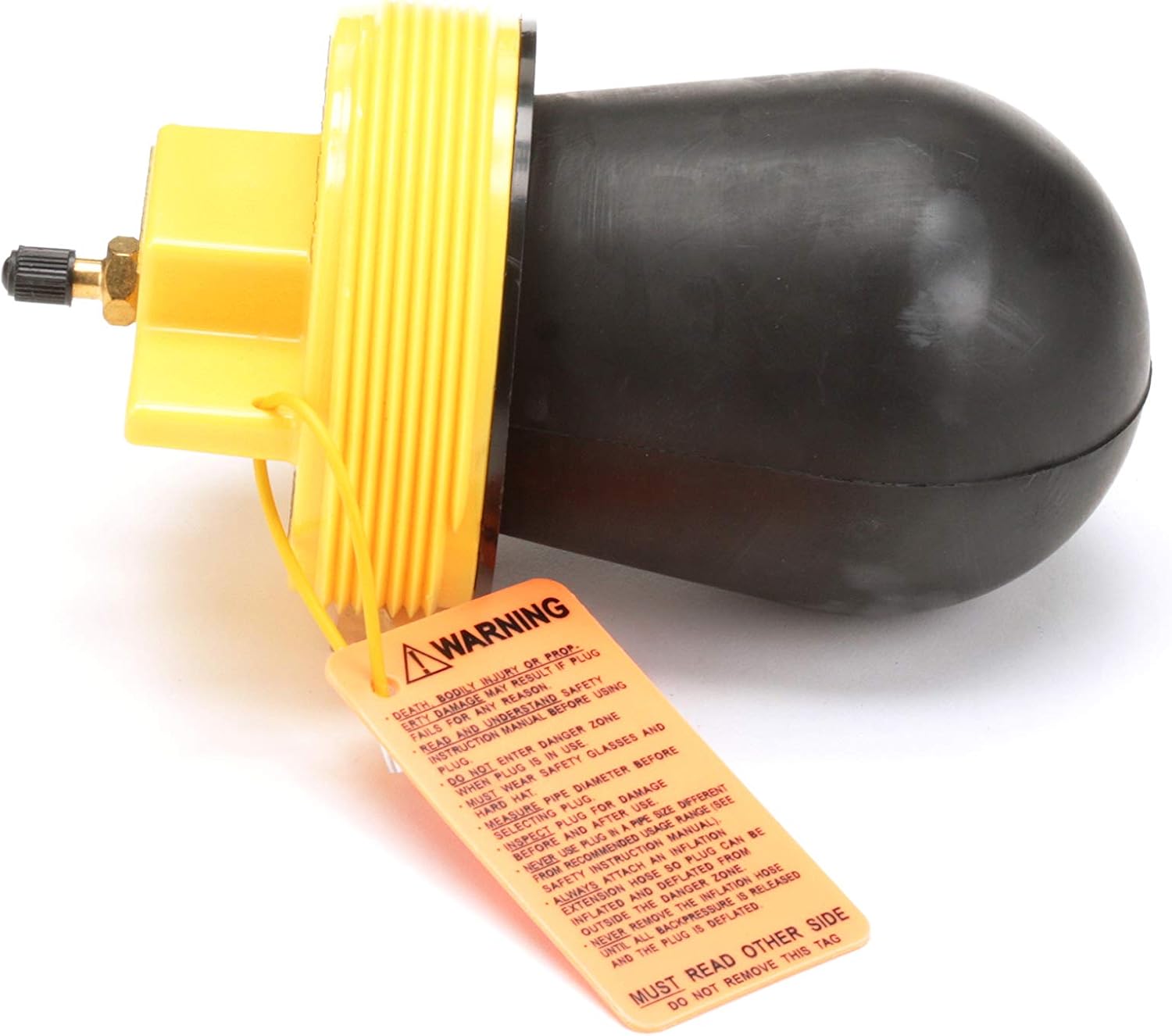 Yellow pneumatic plug with black rubber bulb, brass fitting, and warning label attached.