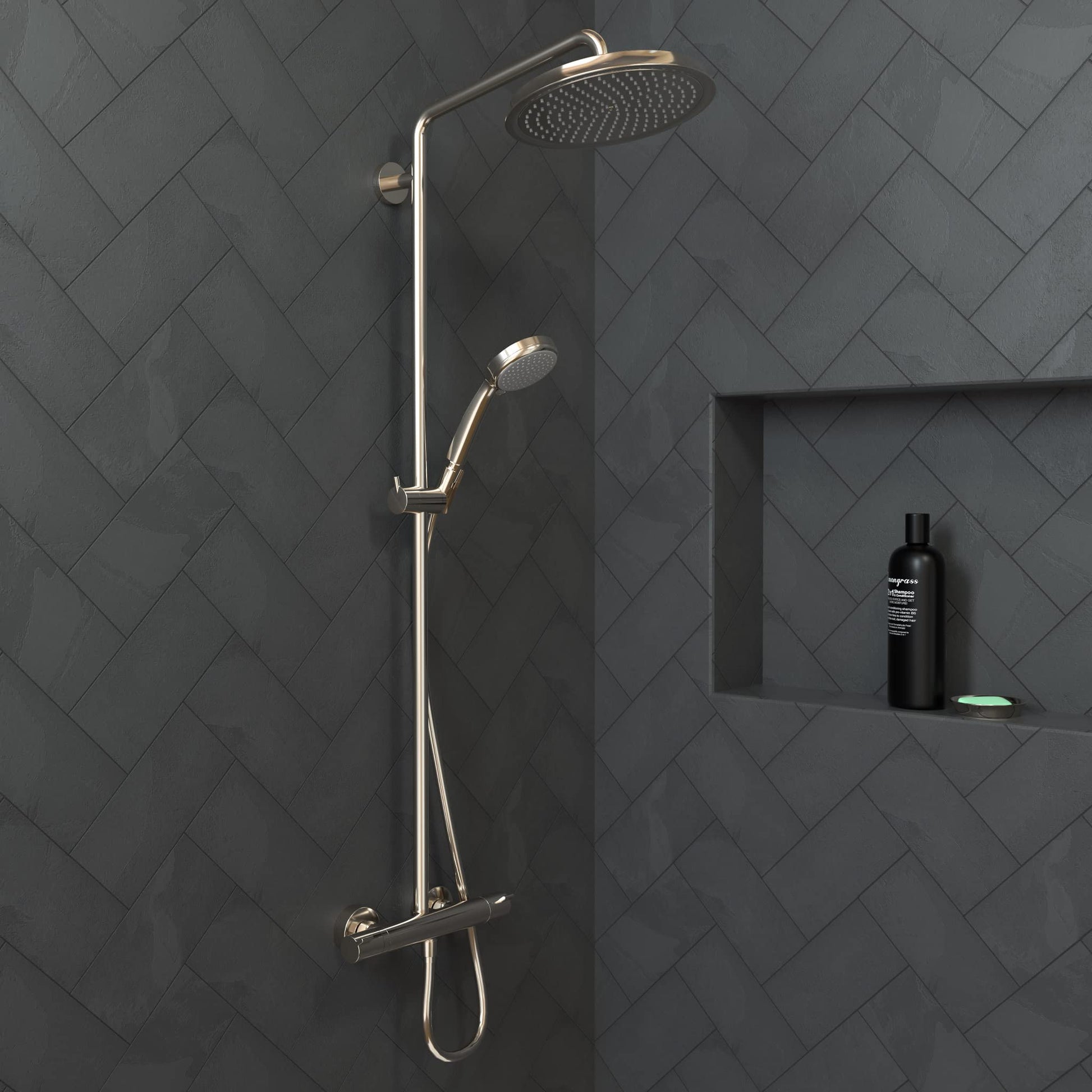 Polished nickel shower system with overhead rain head and handheld spray mounted on dark tile wall.