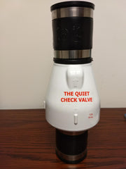 Two-inch PVC check valve with black top and bottom sections, white middle body labeled "The Quiet Check Valve," and metal ban