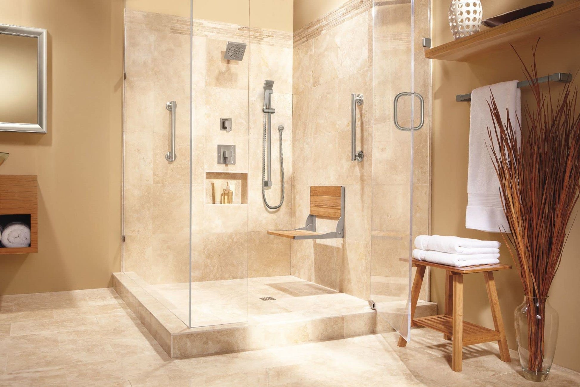 Brushed nickel handheld showerhead with curved slide bar mounted on tile shower wall with metal hose.