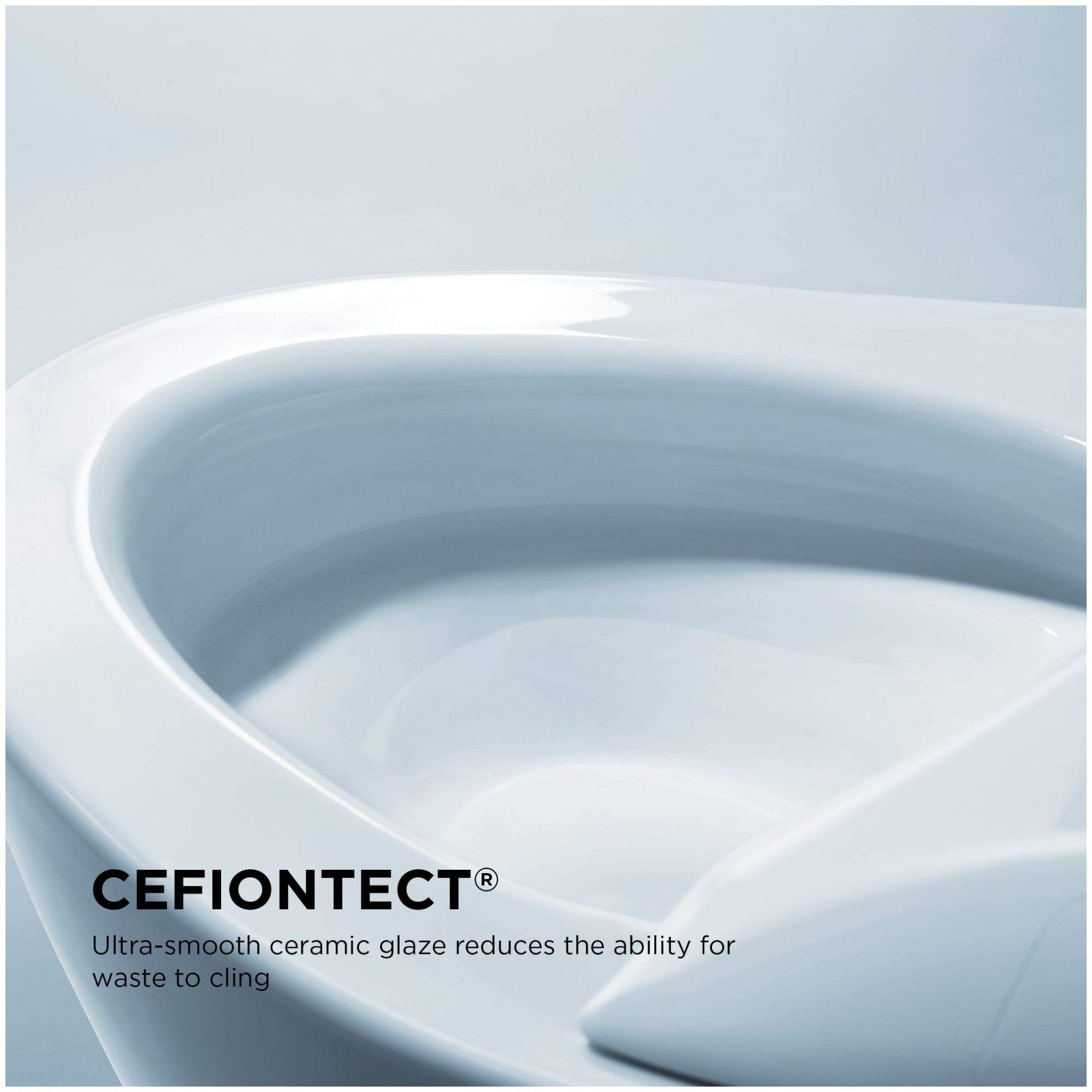 White elongated toilet bowl with closed lid shown from angled top view.