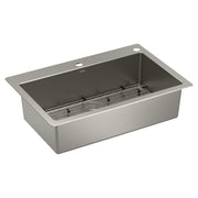 Stainless steel single bowl kitchen sink with metal grid insert and two faucet holes on brushed rim.