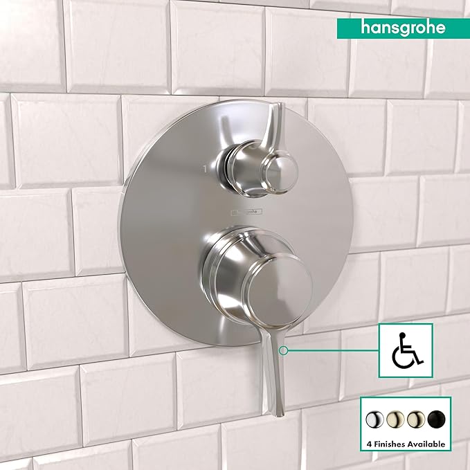 Round chrome pressure balance trim with diverter and dual control handles mounted on white subway tile.
