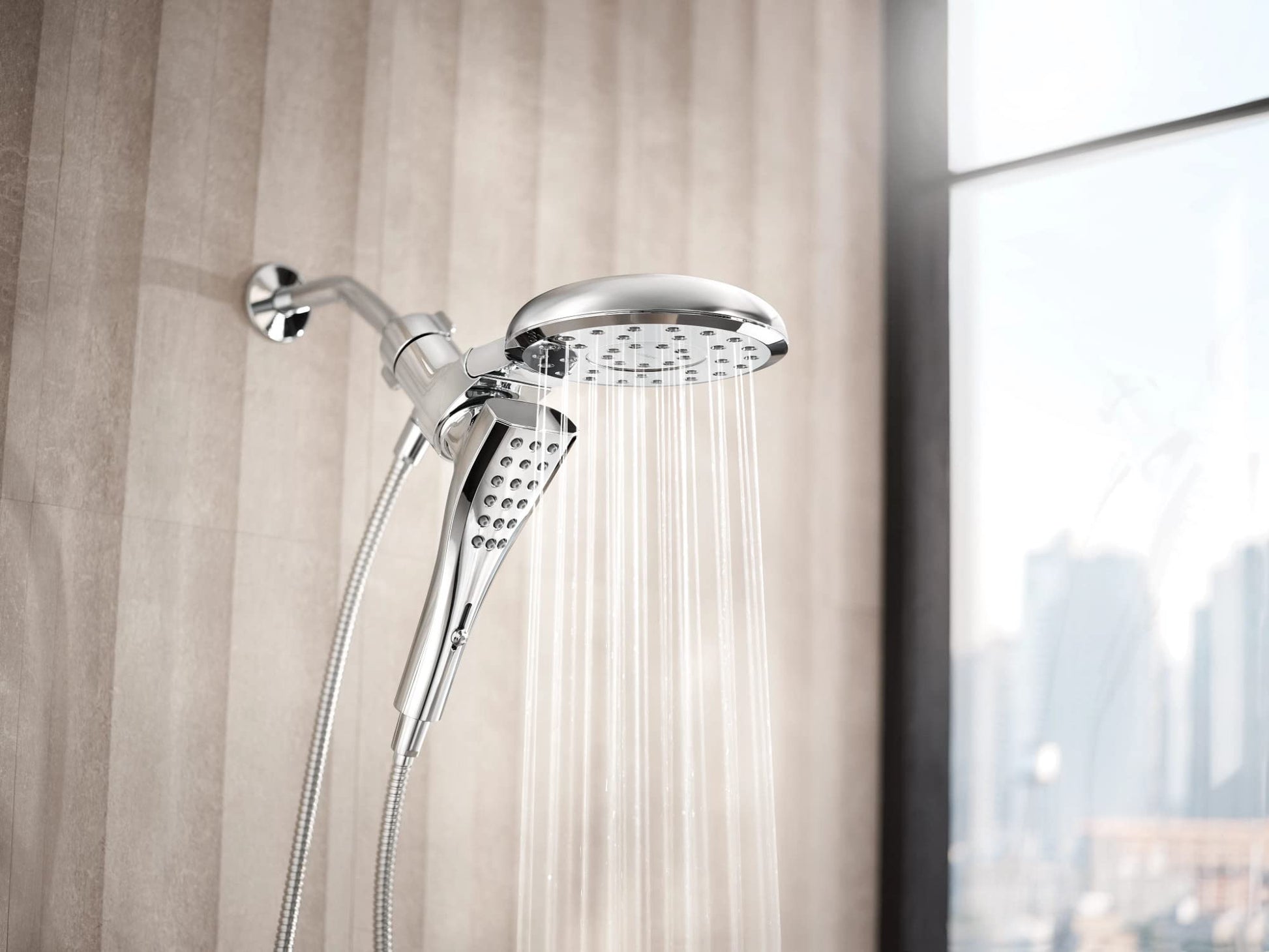 Chrome shower system with 7-inch fixed head and handheld spray connected by hose.