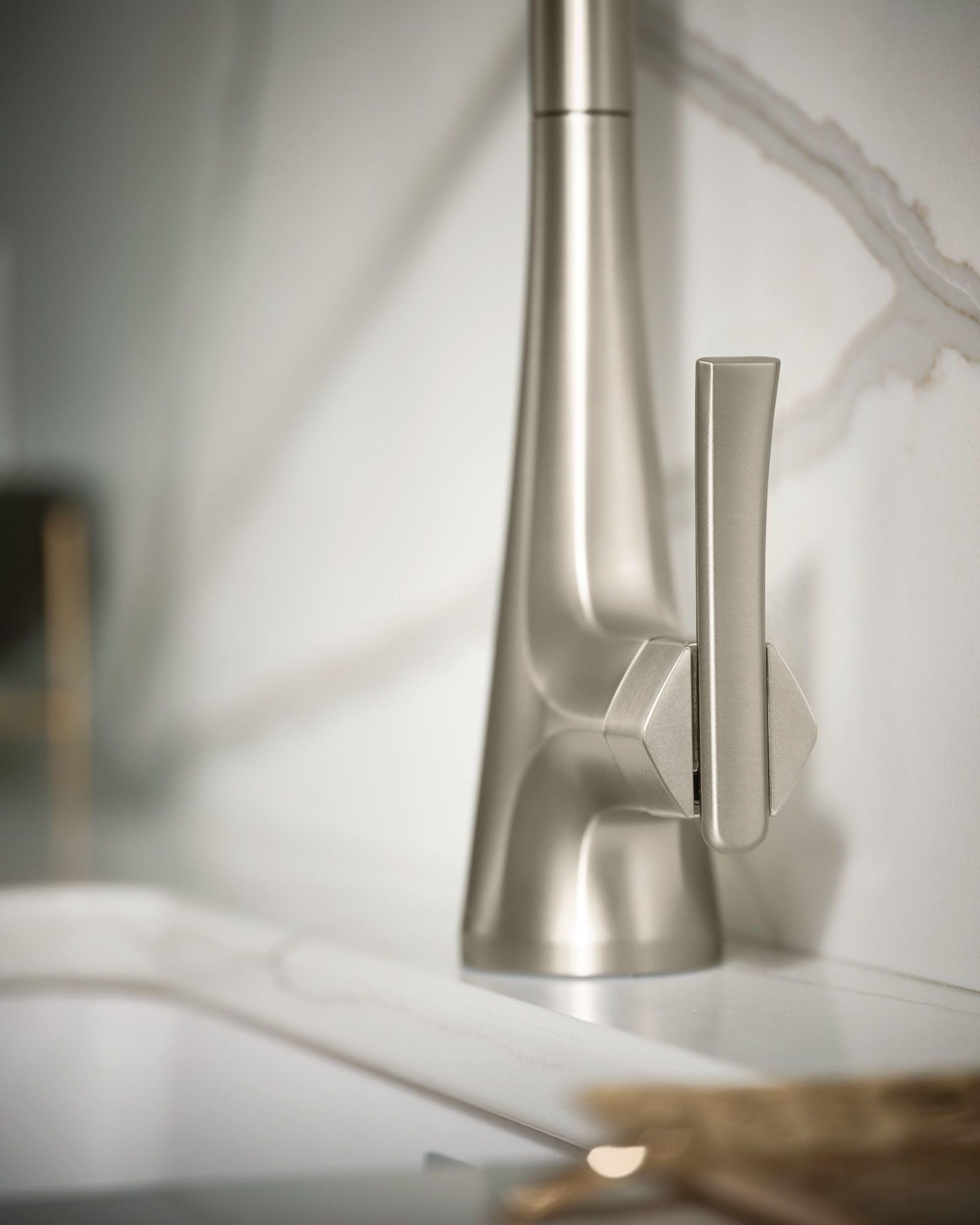 Stainless steel kitchen faucet with single handle and pull-down sprayer in spot resist finish.