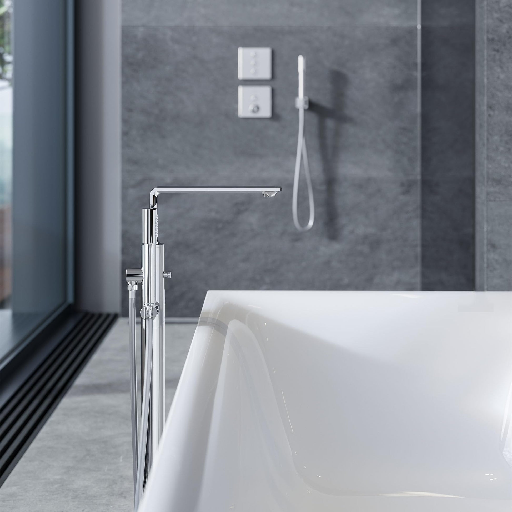 Chrome hand shower with single spray attached to wall-mounted holder next to freestanding bathtub in bathroom.