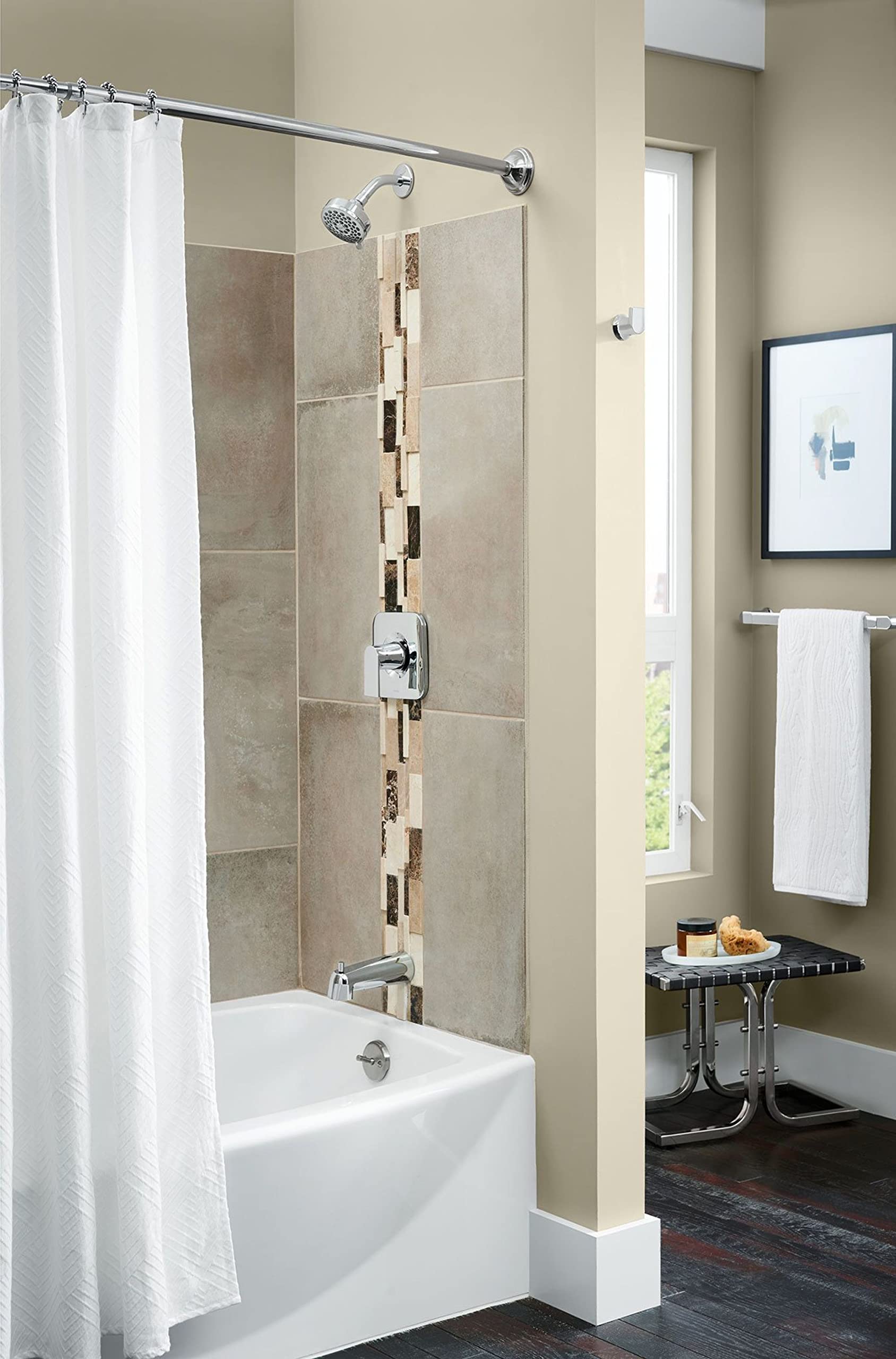 Chrome wall-mount robe hook with circular mounting plate installed on bathroom wall next to shower enclosure.