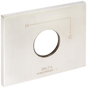 Stainless steel escutcheon plate with circular opening and Delta 14 Multichoice branding.