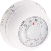 Round white mechanical thermostat with temperature dial showing 50-80 degrees and mode selector labeled Cool, Off, Heat, and 
