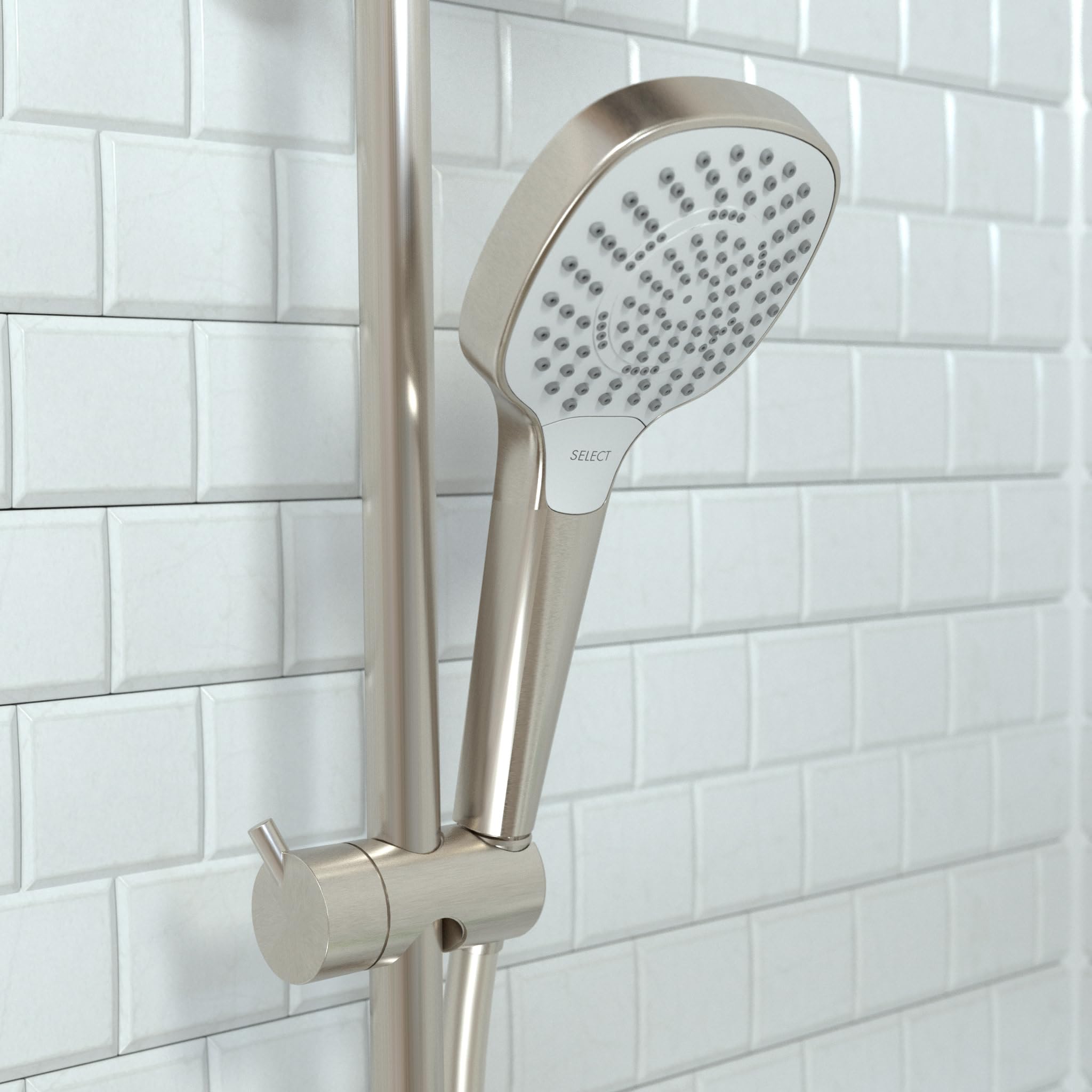 Brushed nickel handheld showerhead with perforated face and adjustable holder mounted on subway tile wall.