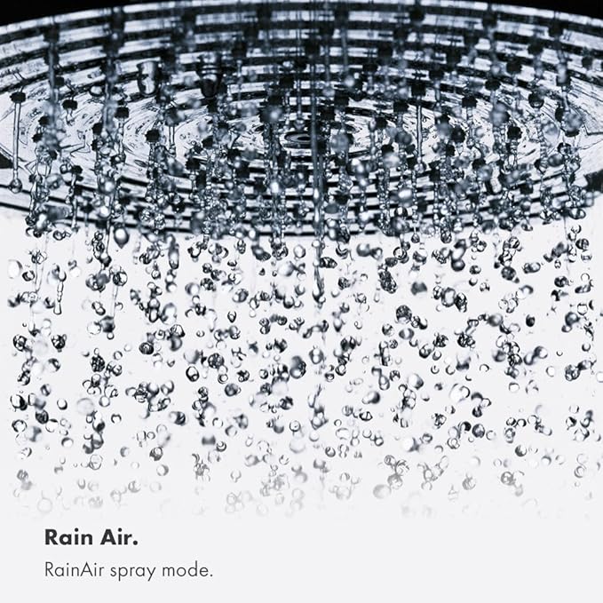 Chrome shower head with round face spraying water downward in rainfall pattern.