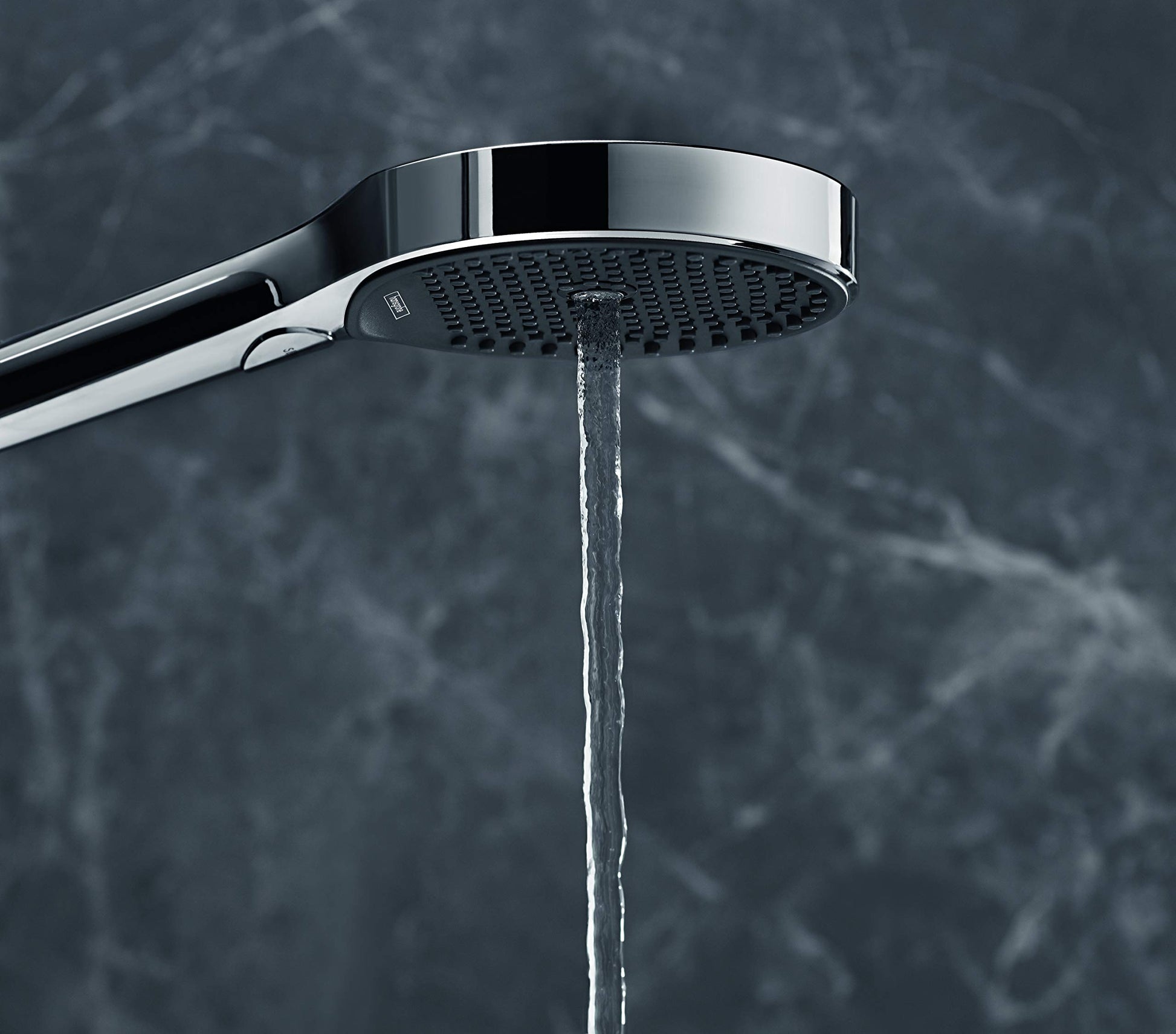 Chrome handheld showerhead with perforated faceplate and curved arm, dispensing water stream.