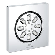 Square chrome body spray with circular face featuring eight oval spray nozzles arranged around center, black trim ring, and G
