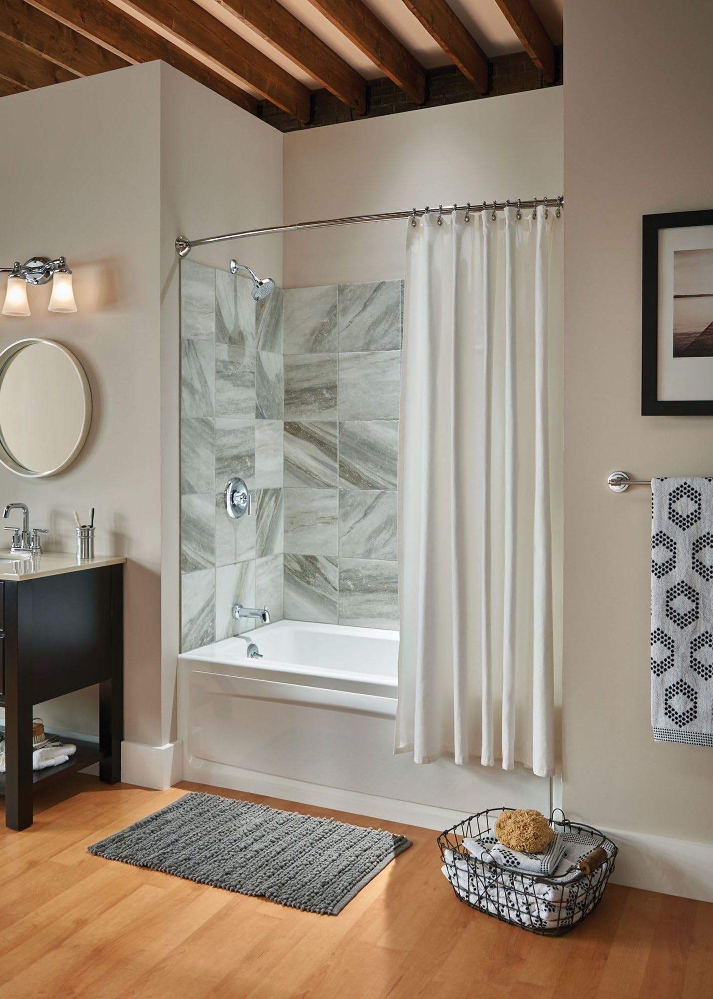 Chrome three-light vanity fixture with frosted glass shades mounted above bathroom sink.