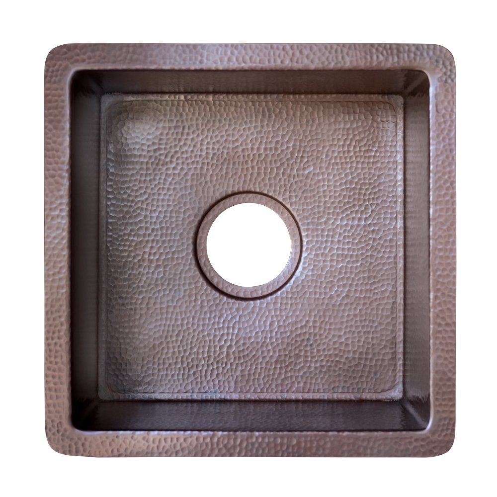 Square hammered copper sink with antique finish and circular drain hole, viewed from above.