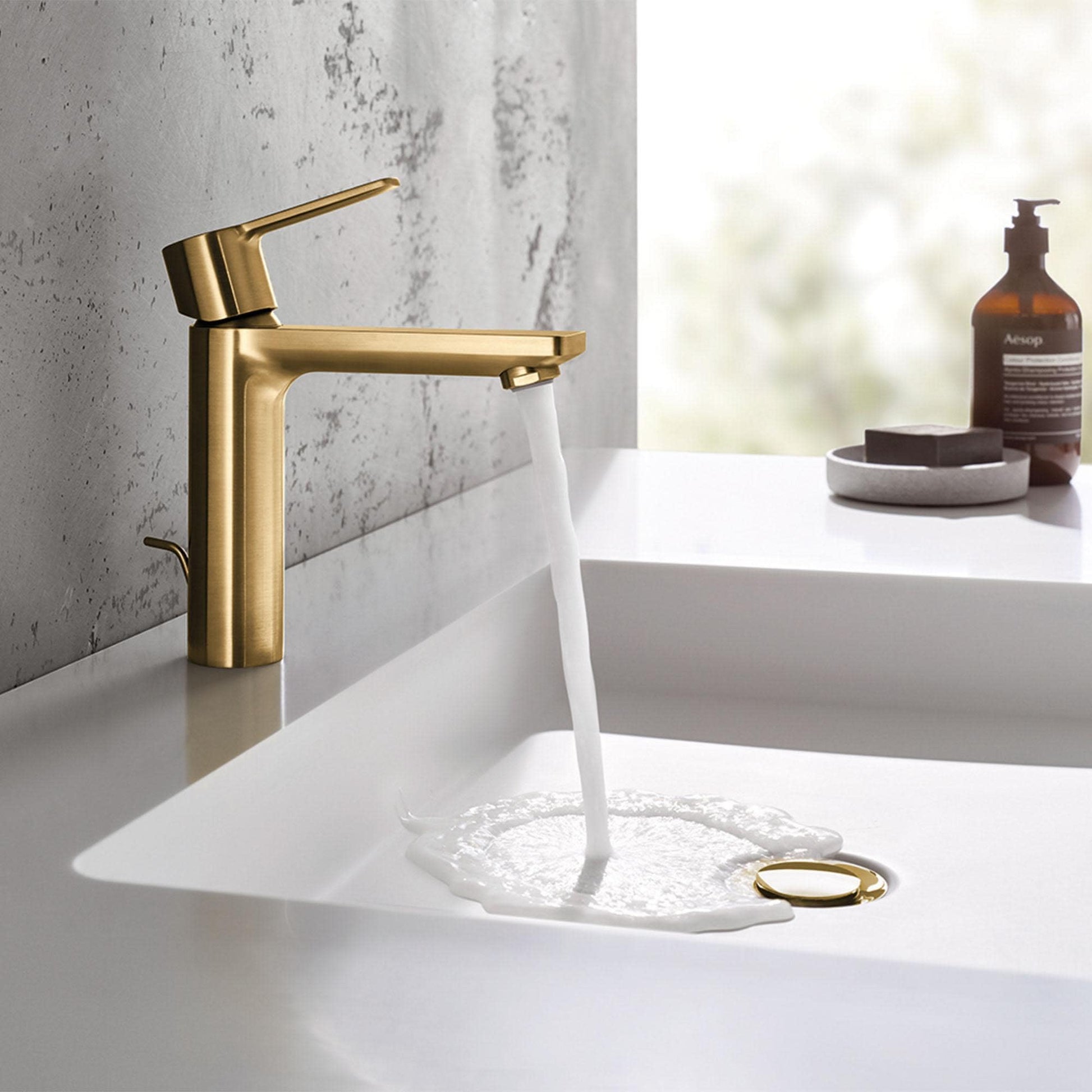 Matte black single-handle bathroom faucet with angled spout dispensing water into white sink basin.