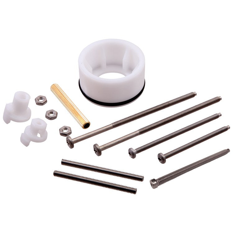 Plumbing extension kit containing white plastic fittings, metal hex nuts, brass tube, and stainless steel screws.