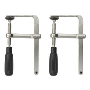 Two metal C-clamps with black rubber handles and threaded screws for tightening.