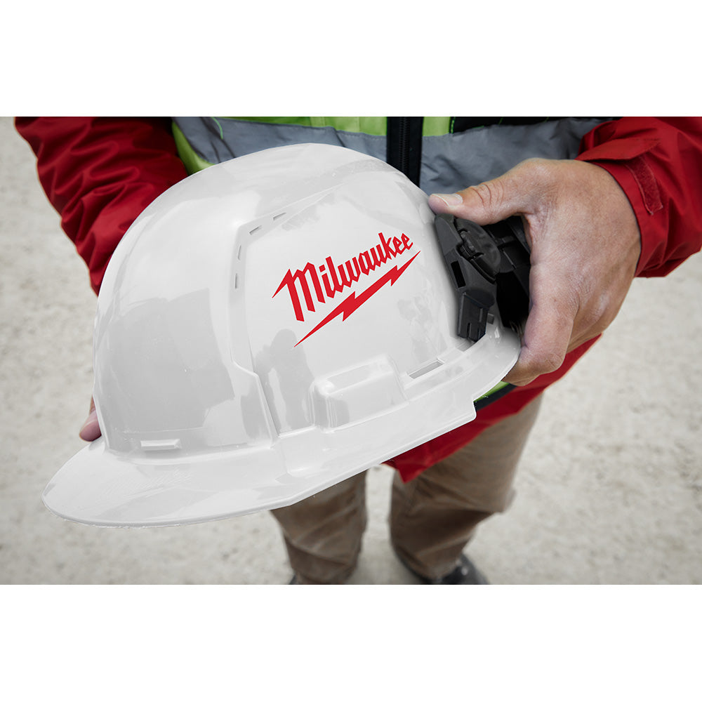 White hard hat with front brim, vented design, and black ratcheting suspension system visible inside.