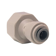 Tan plastic push-fit connector with hexagonal nut and black opening on end.