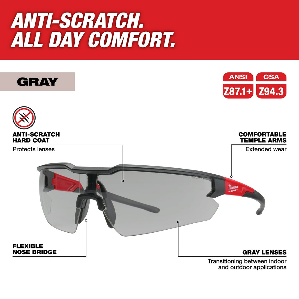 Gray safety glasses with anti-scratch lenses, flexible nose bridge, and red temple arms for extended wear.