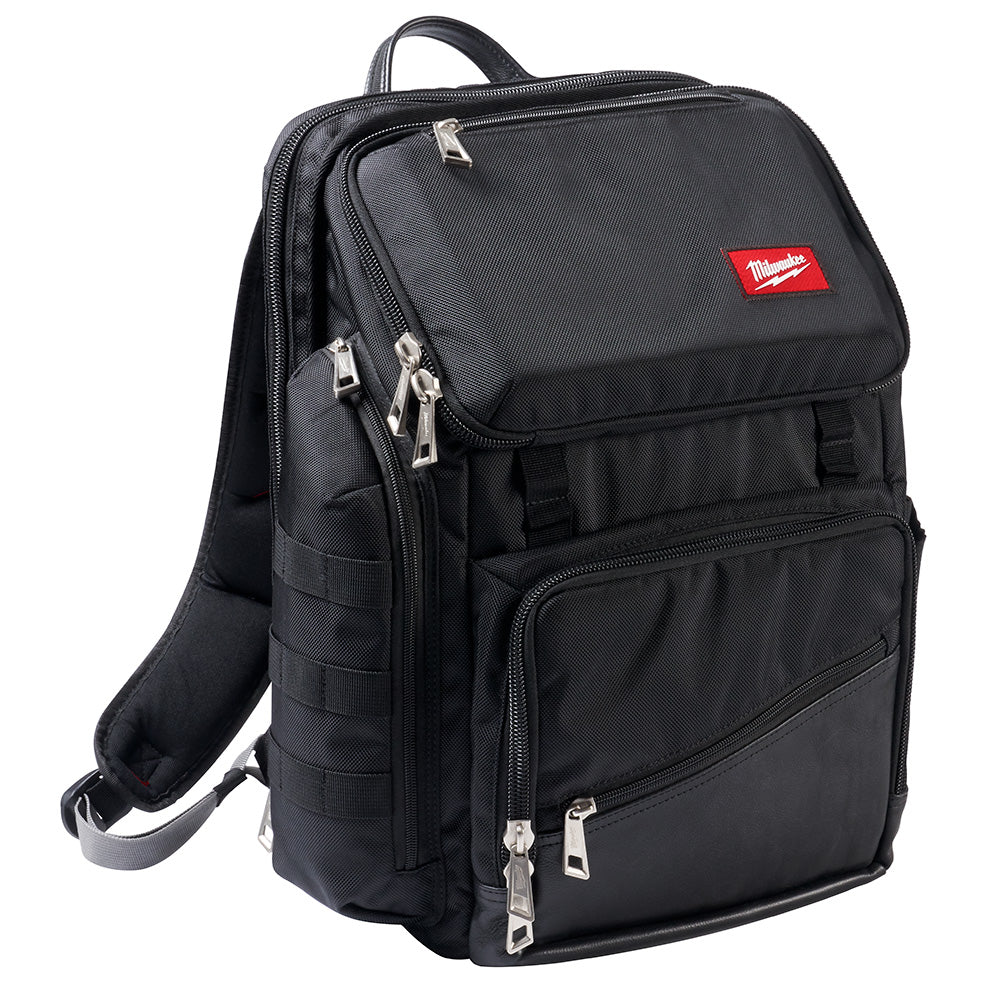 Black backpack with multiple zippered compartments, padded straps, and Milwaukee brand logo on front pocket.