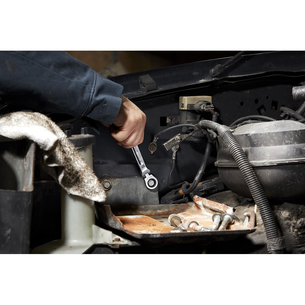 24mm chrome ratcheting combination wrench with flex head being used on engine hardware.