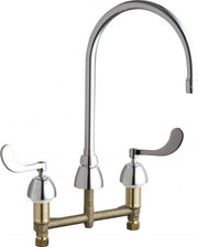Polished chrome deck-mounted faucet with high curved spout and two lever handles on brass base.