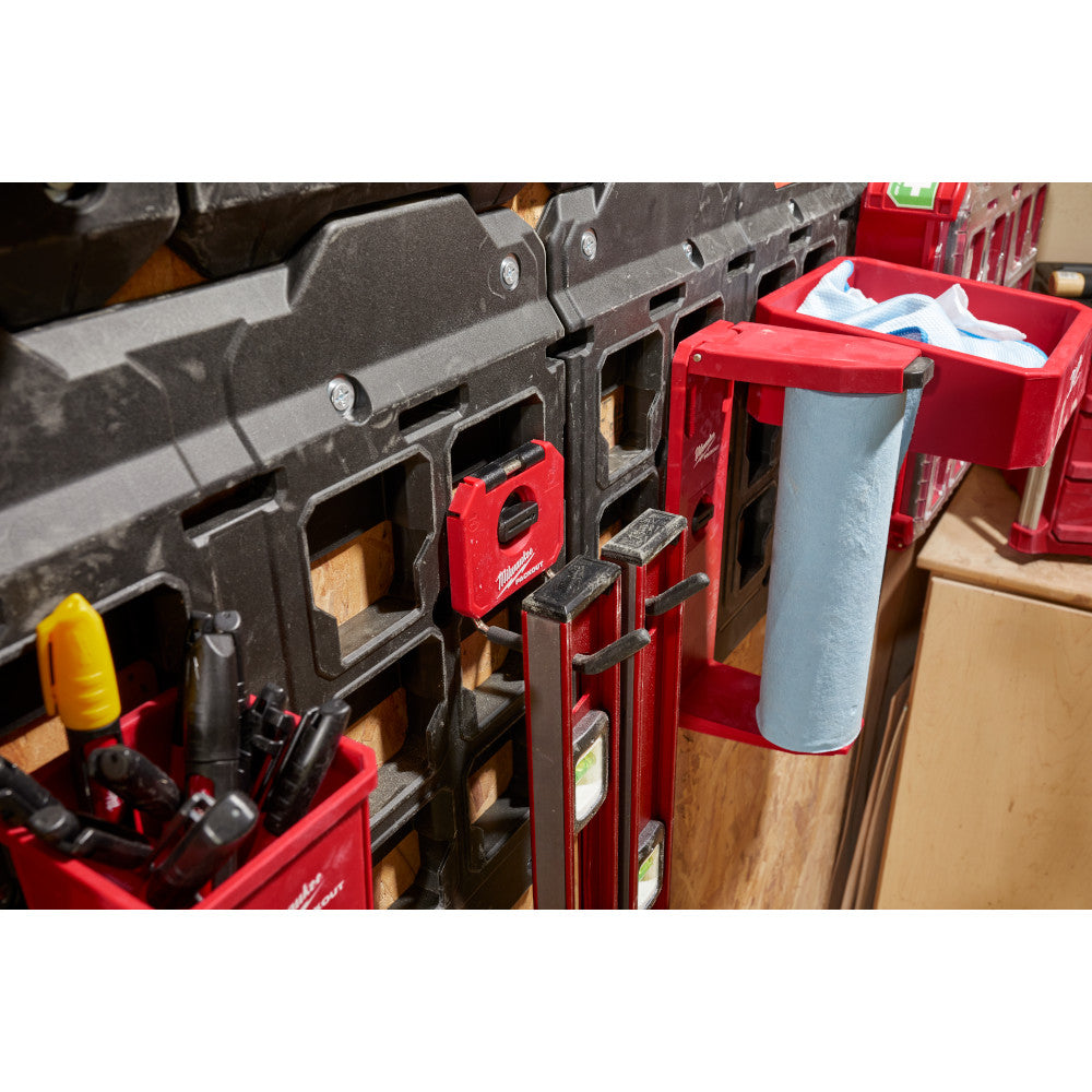 Black straight hook mounted on Milwaukee PACKOUT storage system with red base and compartments.