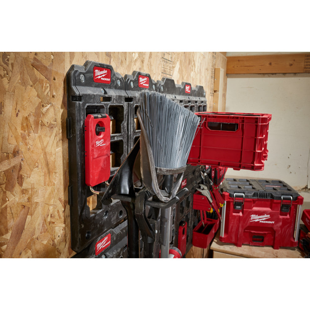 Black Milwaukee PACKOUT straight hook mounted on modular storage wall system holding coiled wire.