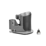 Milwaukee compact router offset base with gray metal body, black grip handle, and detachable metal attachment piece.