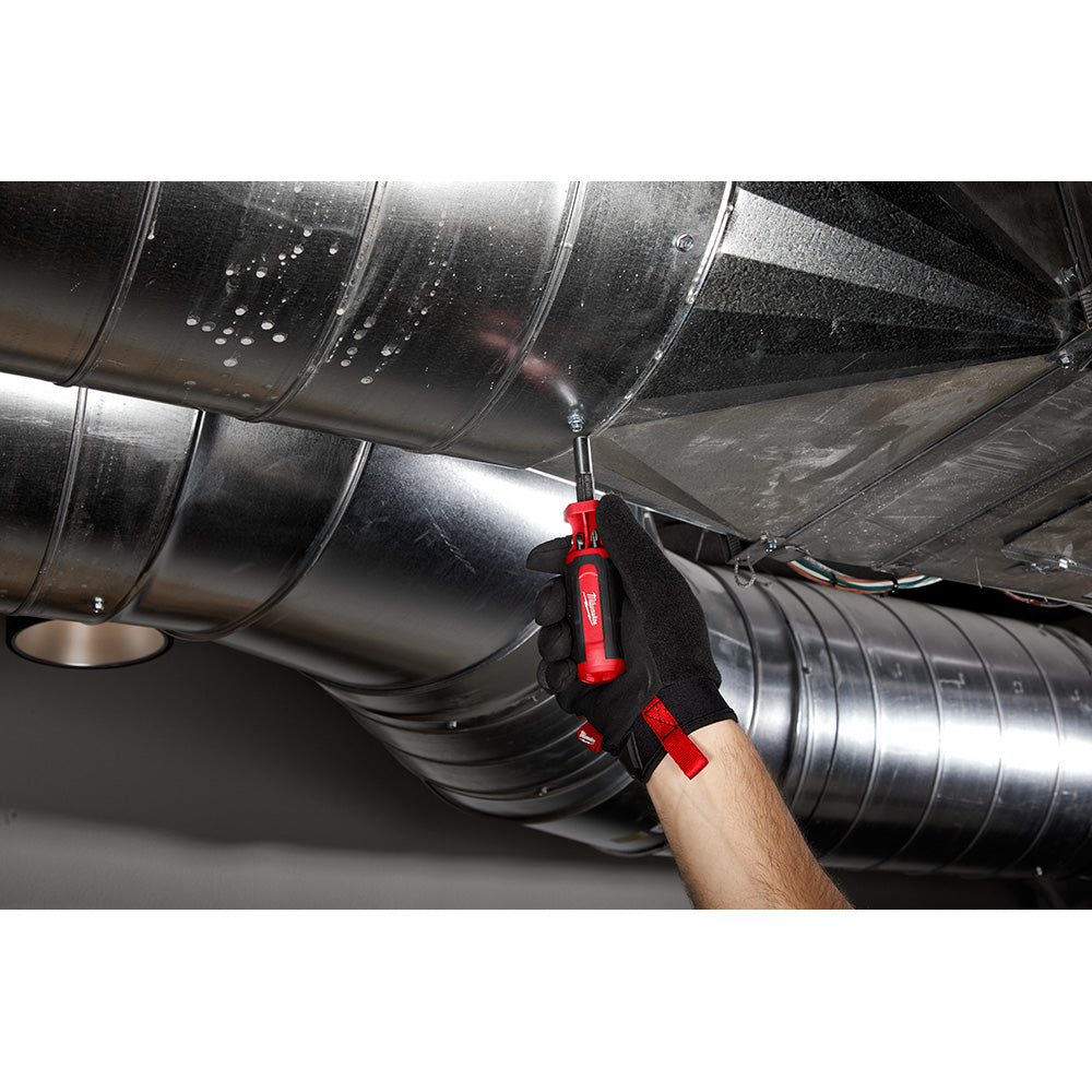 Red and black multi-bit driver being used on metal ductwork in an overhead installation setting.