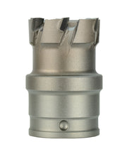 Metallic carbide cutter with four black cutting edges on top and cylindrical shank with quick-change connection.