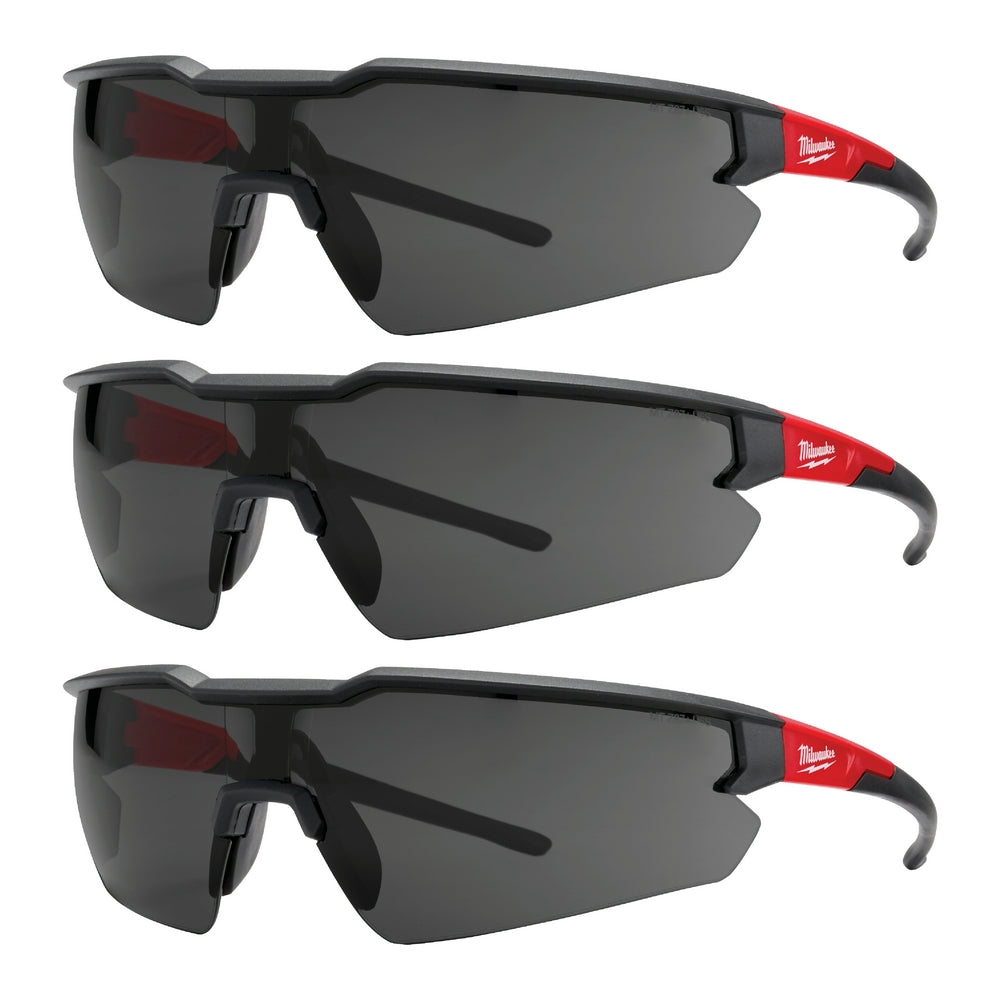 Three pairs of safety glasses with black frames, red temple arms, and dark tinted lenses stacked vertically.