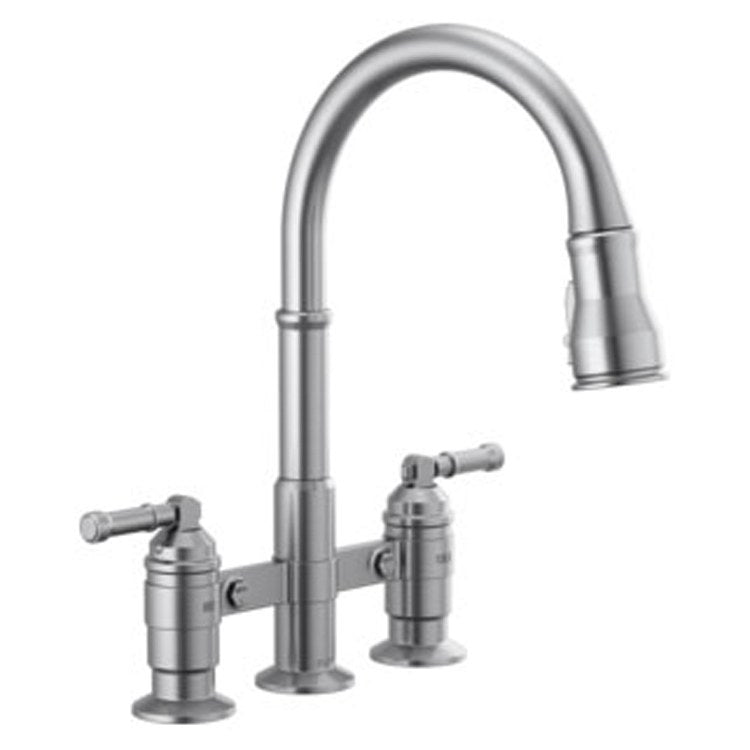 Chrome bridge kitchen faucet with high curved spout, pull-down spray head, and two lever handles.