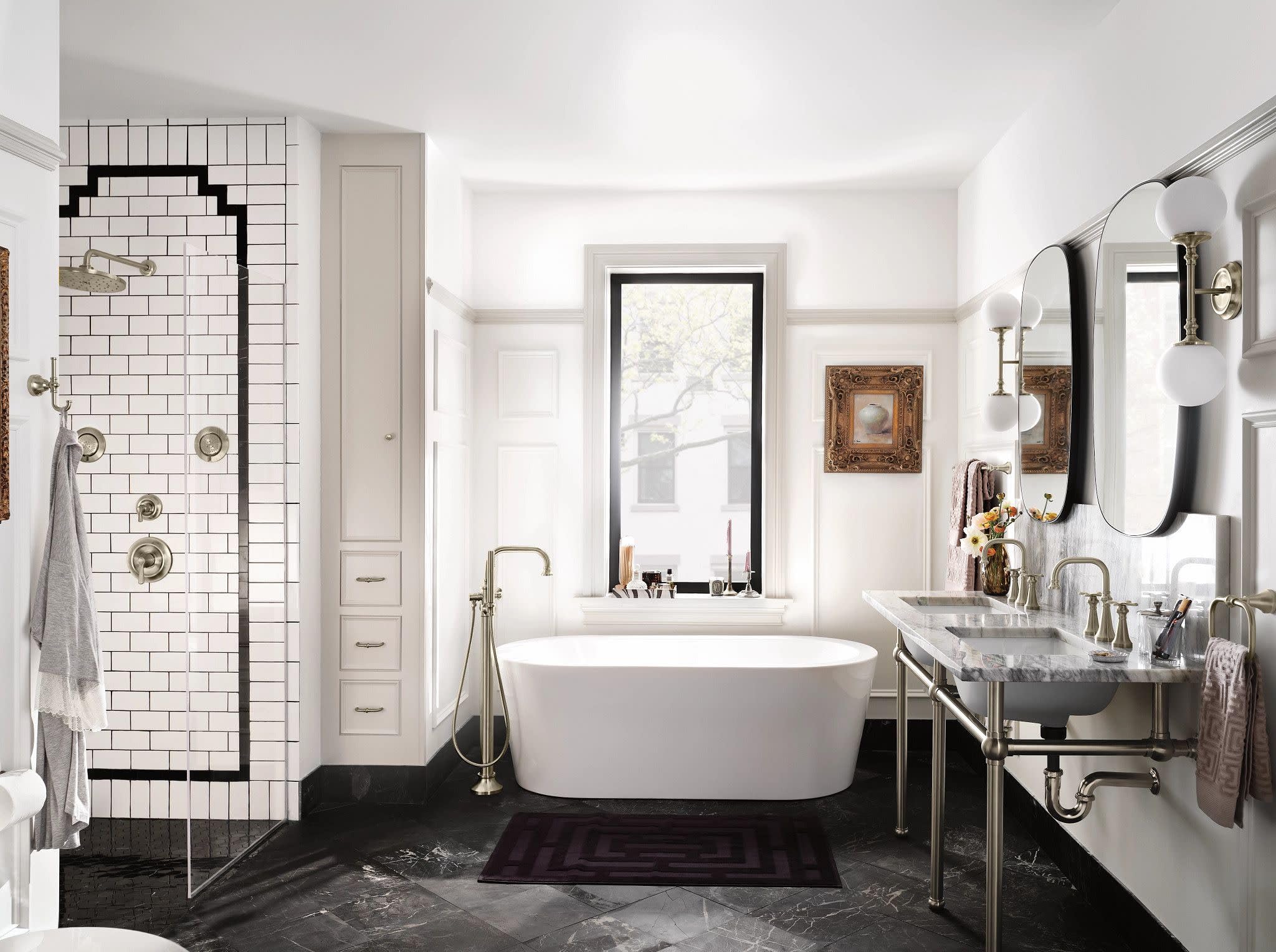 Brushed nickel wall-mounted bathroom faucet trim with traditional cross handles mounted above a white vanity sink.
