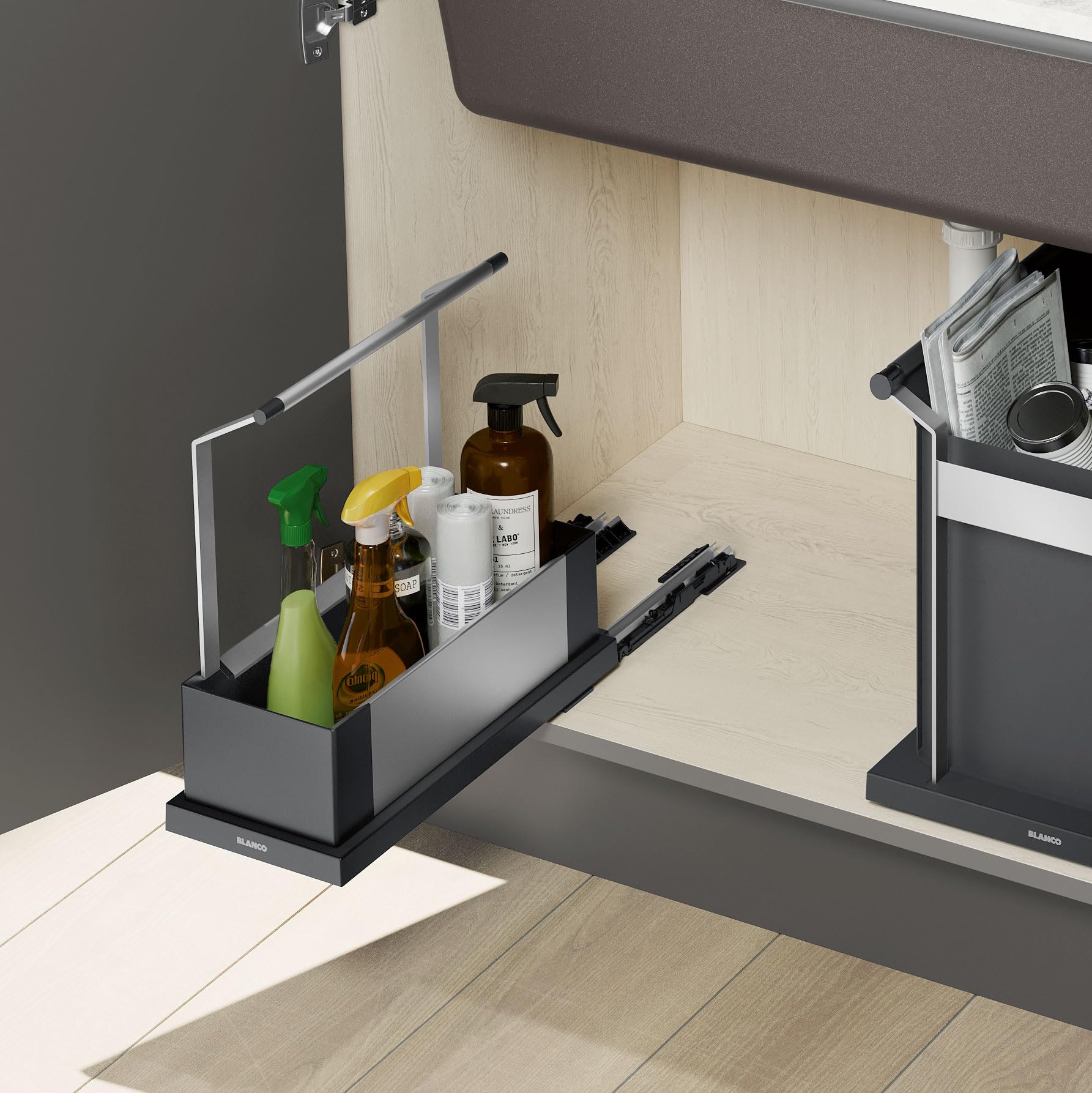 Black single storage caddy mounted inside sink cabinet with cleaning supplies and spray bottles.