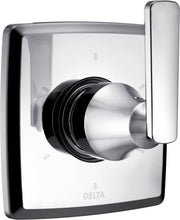 Chrome and white diverter trim with rounded rectangular escutcheon, cylindrical handle, and black accents.