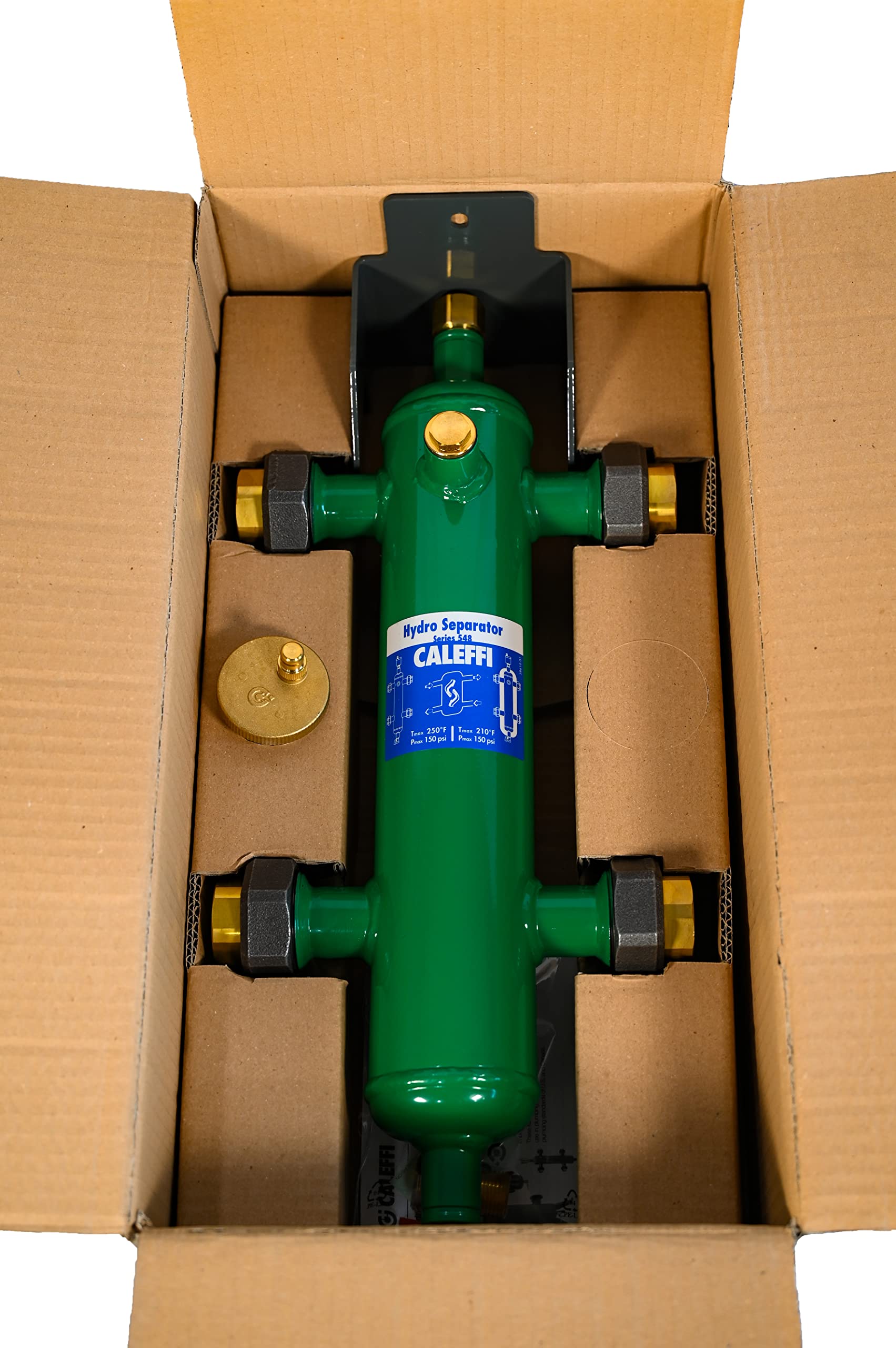 Caleffi hydroseparator with green cylindrical body, brass union fittings, and black mounting bracket in cardboard box.