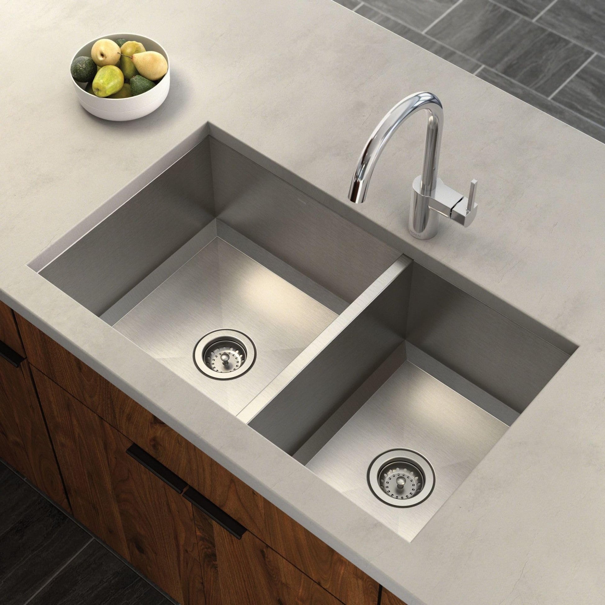 Satin stainless steel undermount double bowl kitchen sink with two drain strainers installed in light countertop.